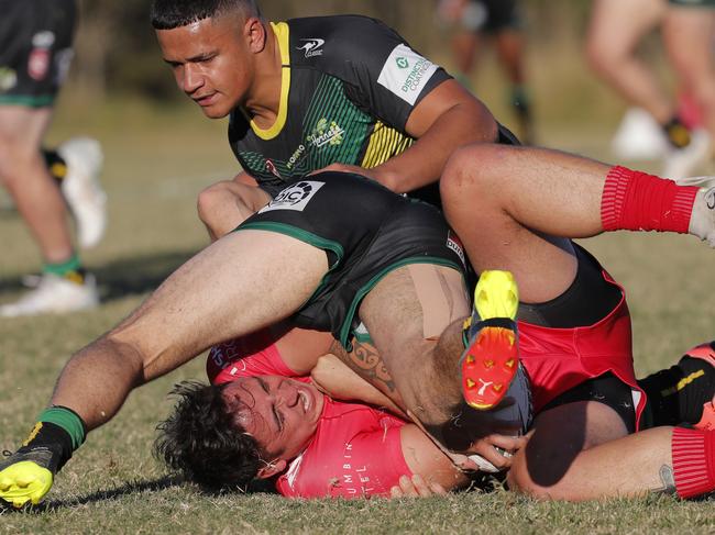 Kalin Ropata of Currumbin Eagles is tackled. Photo: Regi Varghese