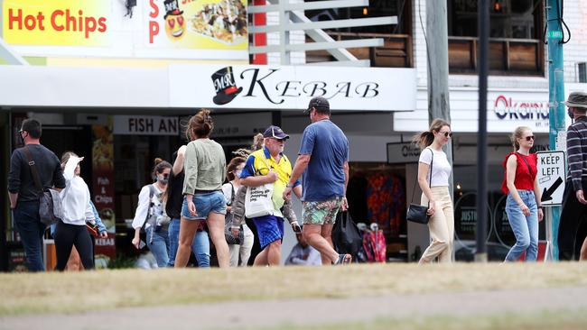 People not wearing masks in Burleigh Heads.