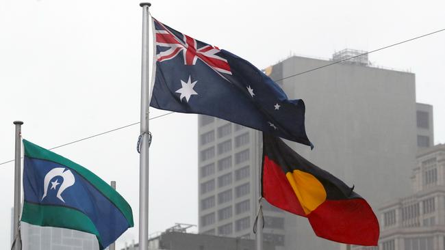 The Torres Strait, Australian and Aboriginal flags fly in Federation Square, Melbourne. Picture: NCA NewsWire/David Crosling