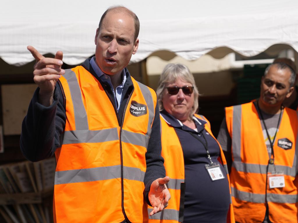 William talks to van drivers during a visit to Surplus to Supper a charity that tackles poverty in Surrey and west London. (Photo by Alastair Grant-WPA Pool/Getty Images)