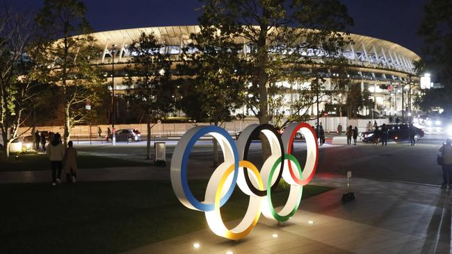 The Tokyo National Stadium lies in wait as athletes begin to arrive in Japan for the Olympic Games, which begin next Friday.