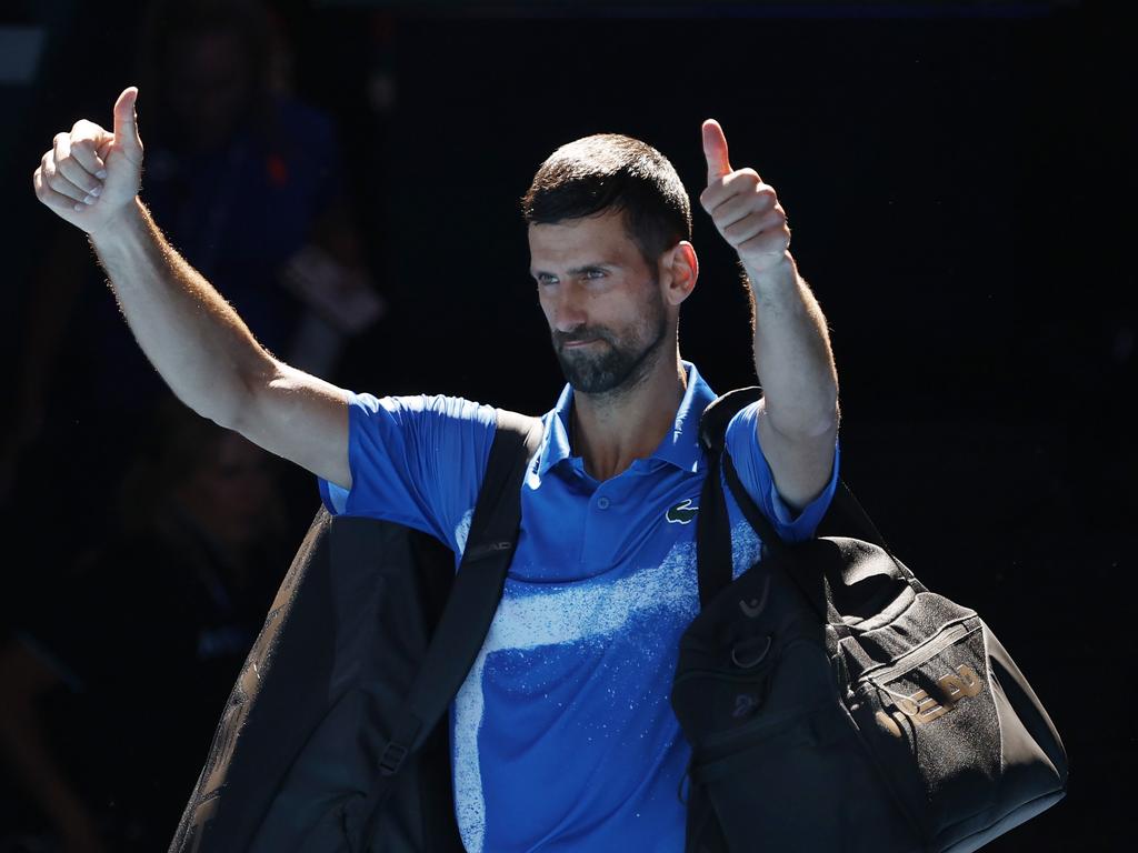 Novak Djokovic gives a thumbs up to the crowd after being forced to withdraw from the Australian Open. Picture: Michael Klein