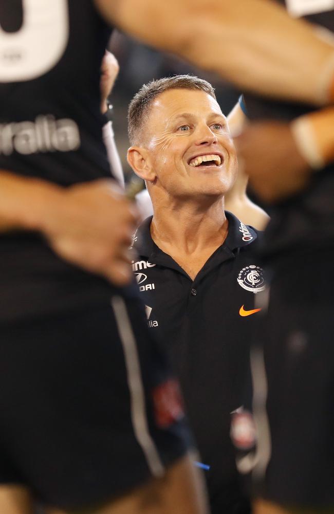 No wonder Bolts is smiling — he’s got a legendary premiership coach in his corner. Picture: AFL Photos/Getty Images