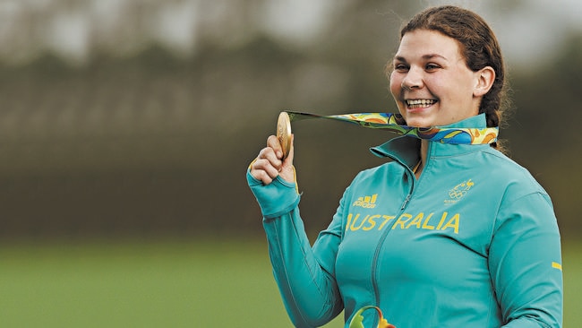 Catherine Skinner shows off her gold medal.