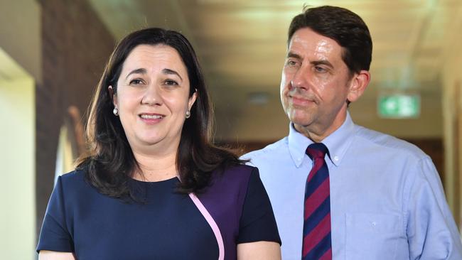 Premier Annastacia Palaszczuk says Health Minister Cameron Dick (right) is like a brother to her so she’s not at all worried that he might try to steal her job. Picture: AAP/Darren England