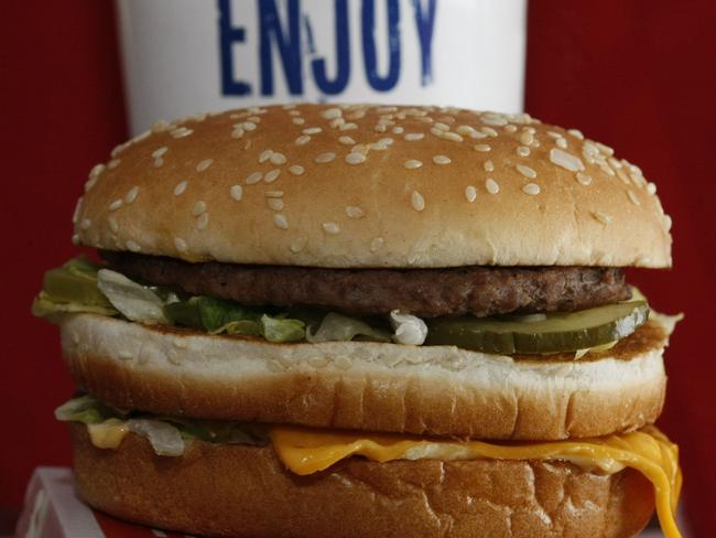 FILE - This Dec. 29, 2009 file photo shows a Big Mac sandwich in front of a drink at McDonald's in North Huntingdon, Pa. McDonald’s on Monday. May 5, 2015 became the latest chain to announce that it’s teaming up with a service called Postmates to offer delivery as a pilot program in New York City, following similar announcements by Chipotle and Starbucks. (AP Photo/Keith Srakocic, File)