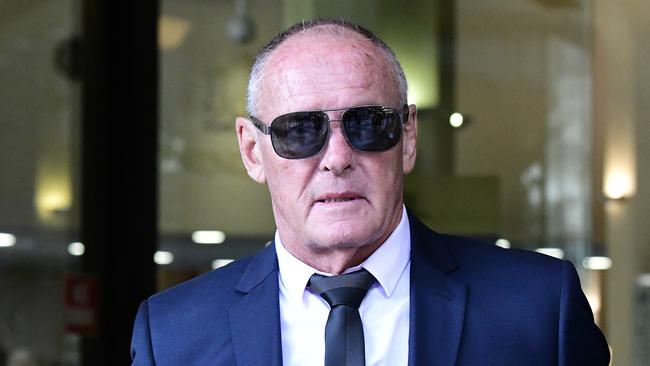 Chris Dawson leaves Sydney’s Downing Centre Local Court yesterday, where he pleaded not guilty to murdering his first wife, Lyn. Picture: AAP