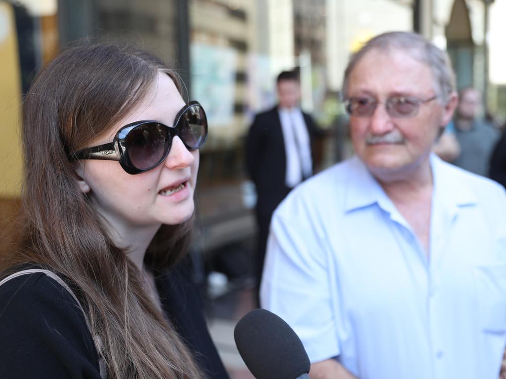 Nicole Lewanski’s dad Henry Lewanski (right) and twin sister Christina speak outside court. Picture: John Grainger