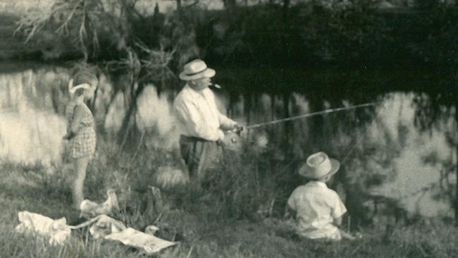 Vladimir Petrov fishing, with Sue-Ellen and Mark Doherty watching on.