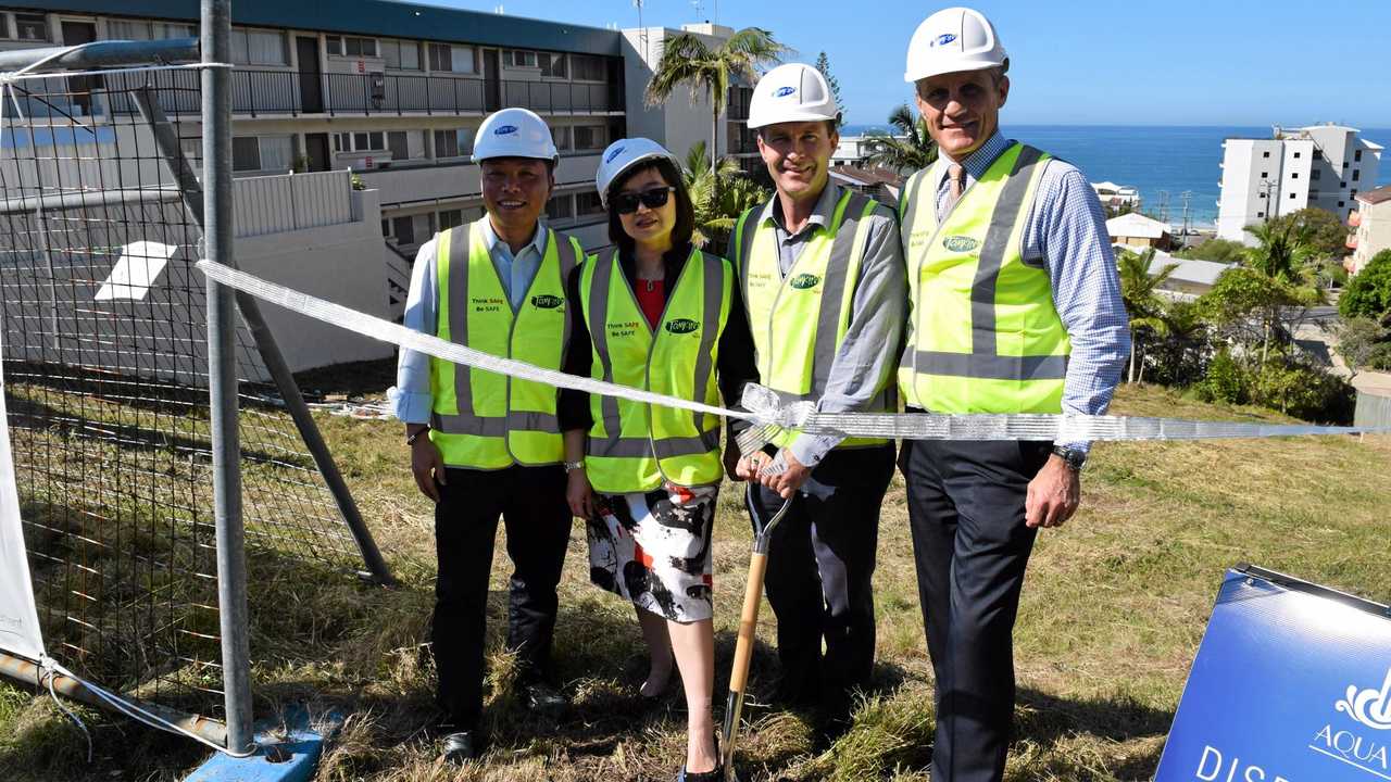 Turning the first sod at the Aqua View Apartments site in Kings Beach are (from left) husband-and-wife developers Alex Yuan and Stella Sun with construction company Tomkins director Mike Tomkins and Councillor Tim Dwyer. Picture: Stuart Cumming