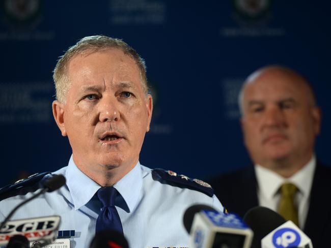 Mr Elliott (background) formed a close friendship with former police commissioner Mick Fuller, and consulted his mate about leaving state politics. Picture: NCA NewsWire/Jeremy Piper