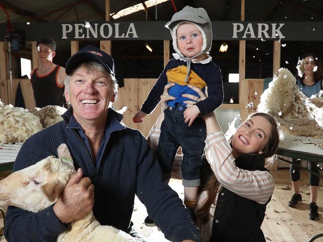 HOLD FOR SUNDAY HERALD SUN----Sheep Shearing in full steam on the Kurraca property called Penola Park, owned by the Holt family with three generations of sheep-shearing. Tony Holt with his daughter Maddison Postle and her son Albert,  18 months.  Picture: Alex Coppel.