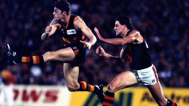 Sean Tasker boots the ball forward for the Crows against Essendon in 1993. Will wants to follow in his old man’s footsteps and enter the AFL.