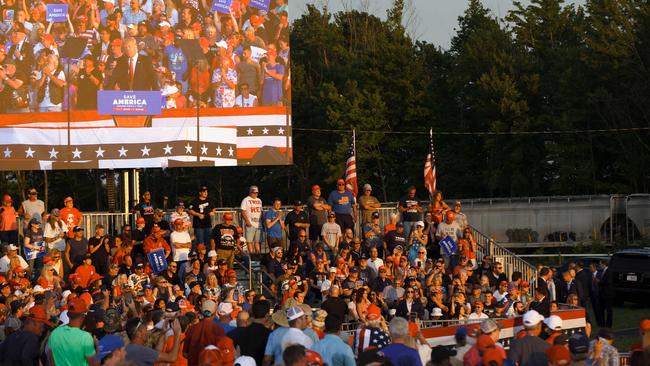 Donald Trump is seen on a screen as his supporters listen to his speech during his campaign-style rally in Wellington, Ohio. Picture: AFP.