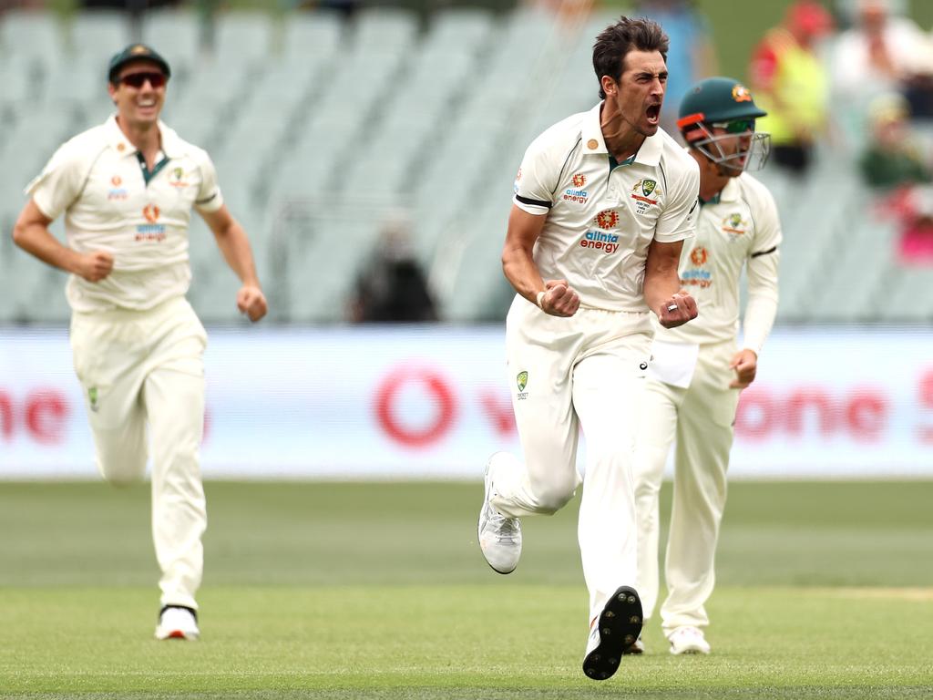 Mitchell Starc of Australia celebrates after taking the wicket of Prithvi Shaw of India.