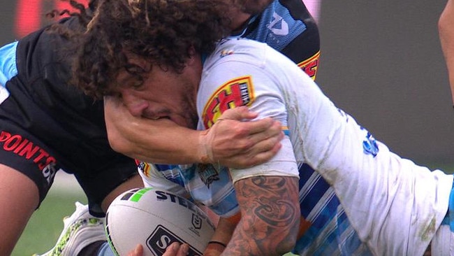 Kevin Proctor bites the arm of Shaun Johnson.