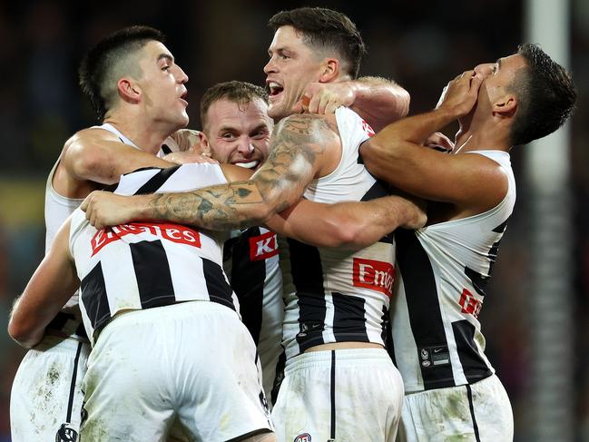 ADELAIDE, AUSTRALIA - APRIL 30: Collingwood players celebrate the win during the 2023 AFL Round 07 match between the Adelaide Crows and the Collingwood Magpies at Adelaide Oval on April 30, 2023 in Adelaide, Australia. (Photo by Sarah Reed/AFL Photos via Getty Images)