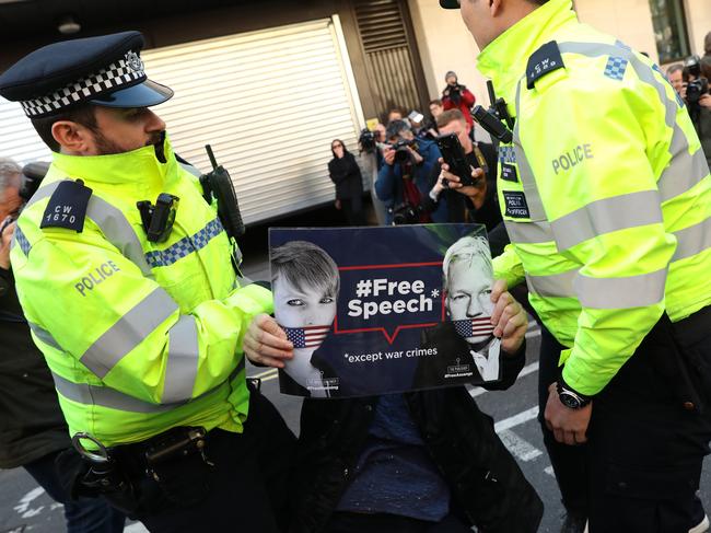 A pro Assange demonstrator is lead away by police officers outside Westminster Magistrates Court on April 11, 2019 in London, England. Picture: Jack Taylor/Getty Images