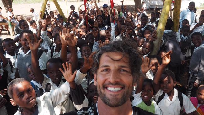 Tim and Anna visiting a school in South Africa.