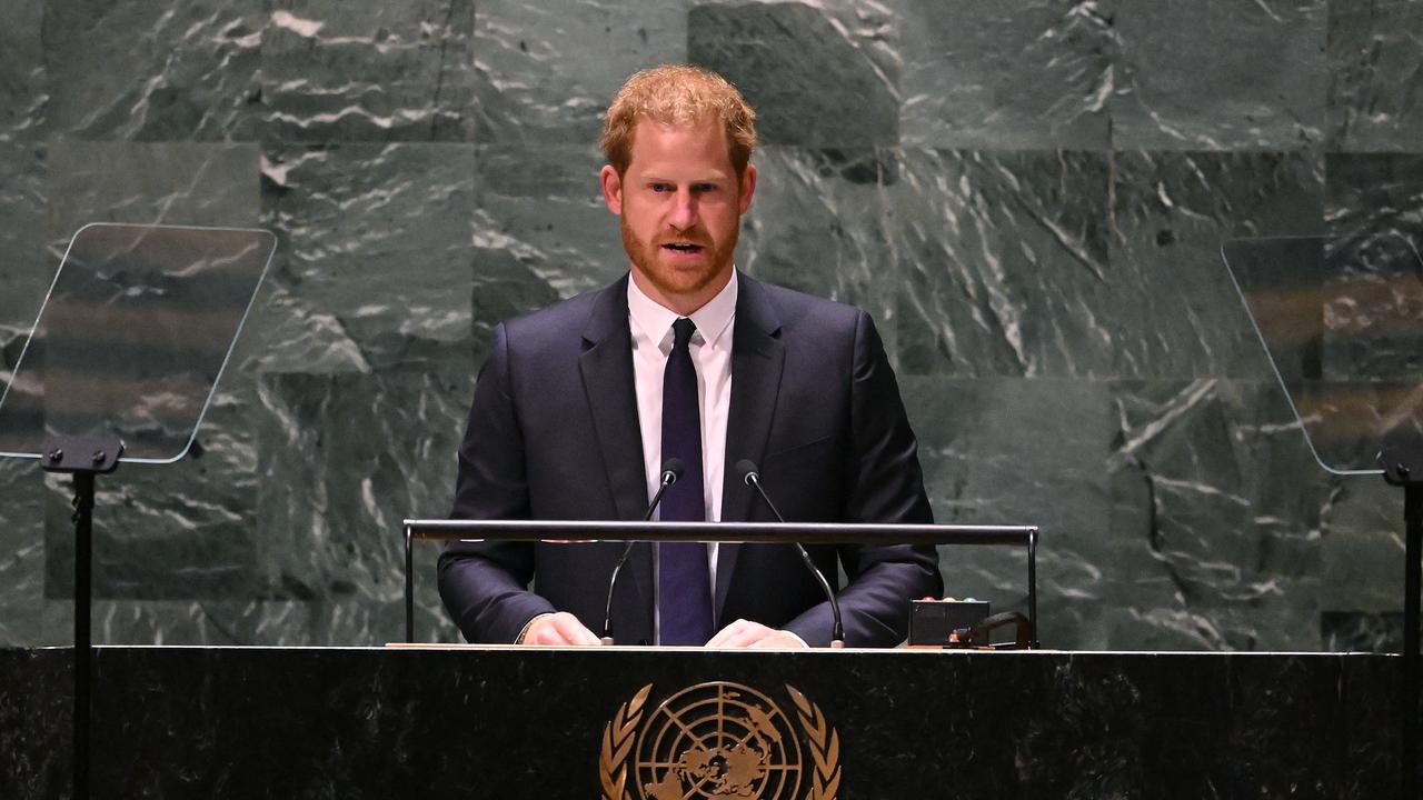 Prince Harry gives a lecture on global poverty to mark Nelson Mandela Day. Picture: Timothy A. Clary / AFP.