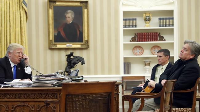 President Donald Trump speaks on the phone to Prime Minister of Australia Malcolm Turnbull, with then National Security Adviser Michael Flynn (centre) and then chief strategist Steve Bannon. Picture: Alex Brandon/AP