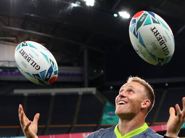 SAPPORO, JAPAN - SEPTEMBER 20:  Reece Hodge of Australia tries to juggle rugby balls following the Australian Wallabies Captain's Run ahead of their opening game against Fiji at the Sapporo Dome on September 20, 2019 in Sapporo, Japan. (Photo by Dan Mullan/Getty Images)