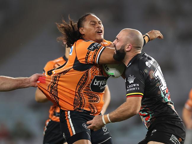 Luciano Leilua of the Wests Tigers is tackled during the round 12 NRL match between the South Sydney Rabbitohs and the Wests Tigers at Accor Stadium, on May 28. (Photo by Cameron Spencer/Getty Images)