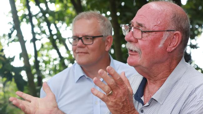 Prime Minister Scott Morrison watches Federal Leichhardt MP Warren Entsch speak at Green Island this week. Mr Entsch called his recent trip to the island. Picture: Brendan Radke