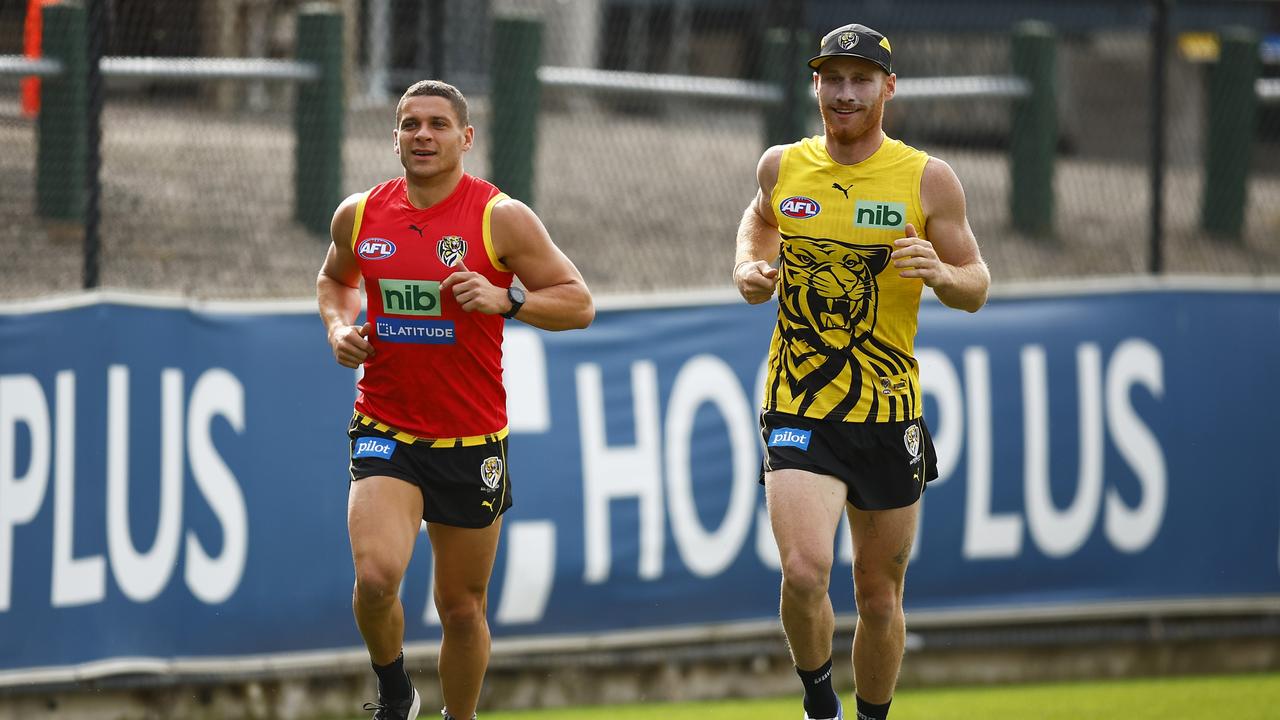 Nick Vlastuin, left with Dion Prestia, is set to return for the Tigers’ clash with Adelaide on Saturday. Picture: Getty Images