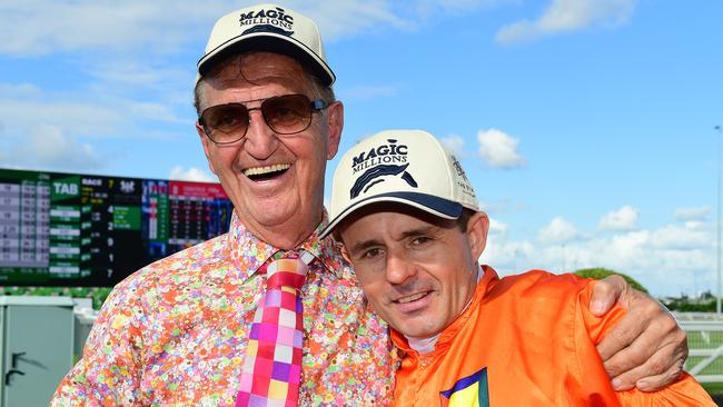 Owner Tom Hedley and jockey Brad Stewart after The Harrovian's 11th straight win at Eagle Farm. Picture: Trackside Photography