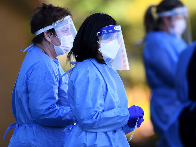 Health workers at a pop-up Covid-19 testing clinic in Queensland. Picture: NCA NewsWire / Dan Peled