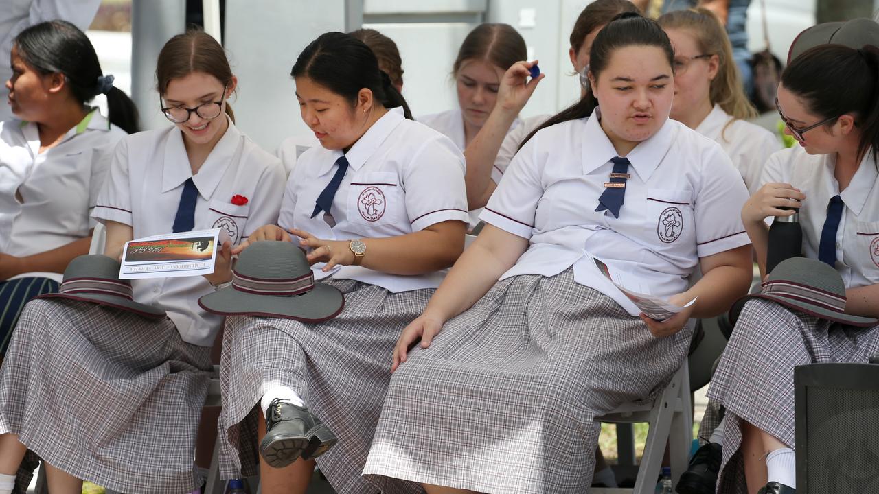 The St Monica's choir members get ready to sing at the Remembrance Day commemorations at the Cairns Cenotaph PICTURE: ANNA ROGERS