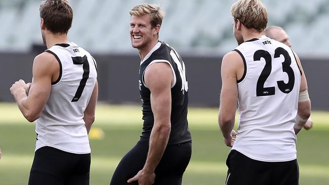 Tom Jonas feels for his hamstring at Port Adelaide training at Adelaide Oval on Wednesday. He will return to the side against Melbourne. Picture Sarah Reed