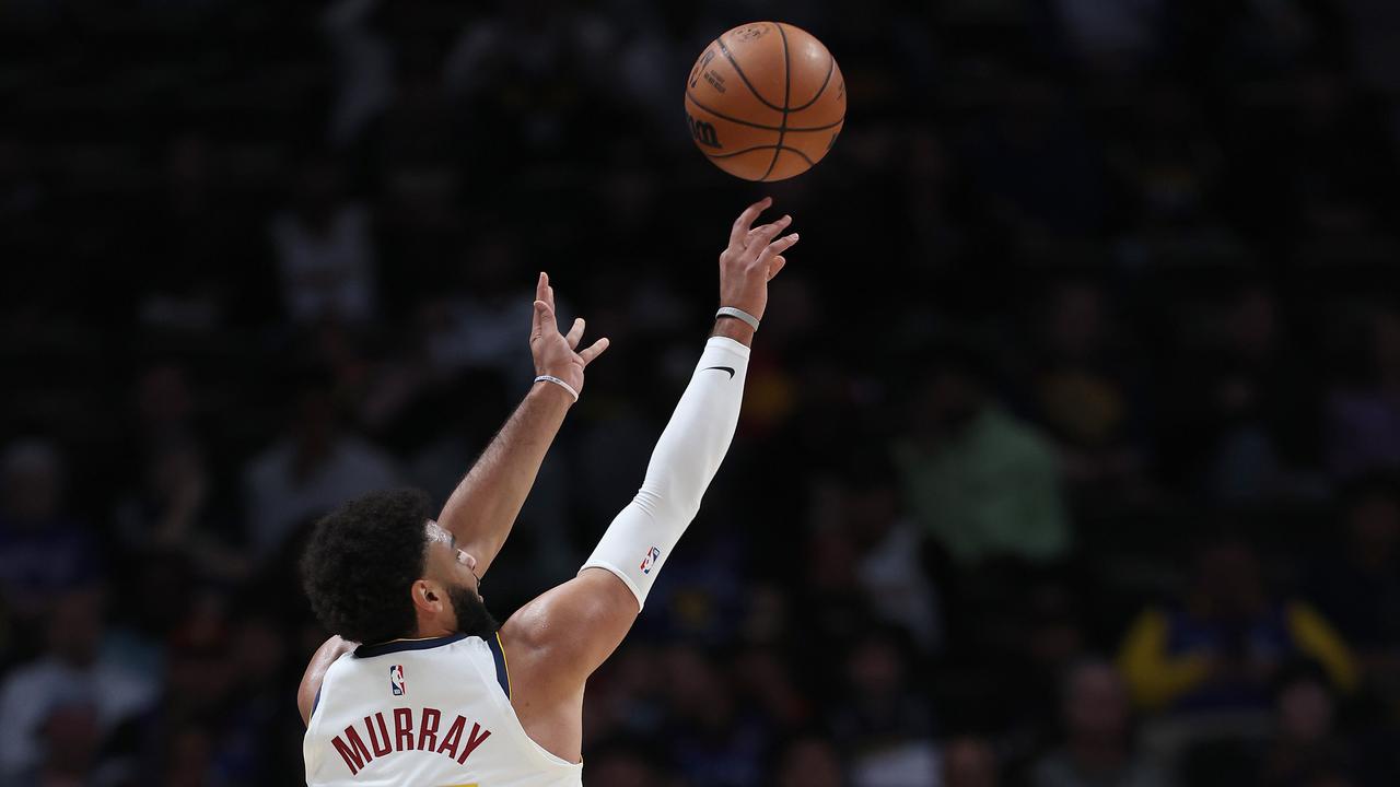 Jamal Murray puts up a shot.  Matthew Stockman/Getty Images/AFP