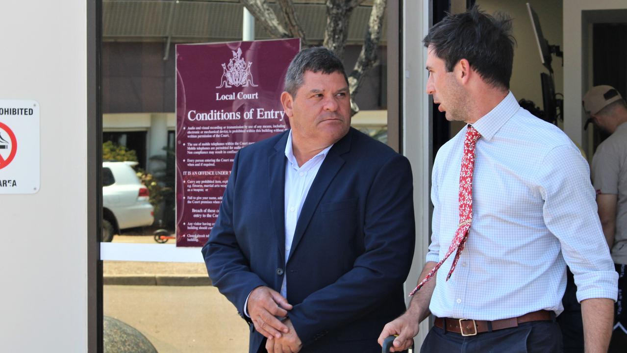 Bootu Creek Mine operator OM Manganese representative Andre de Villiers (left) speaks with lawyer James Stuchbery outside the Darwin Local Court on Monday after the company pleaded guilty to failing to comply with a health and safety duty following a fatal pit wall collapse in 2019. Picture: Jason Walls