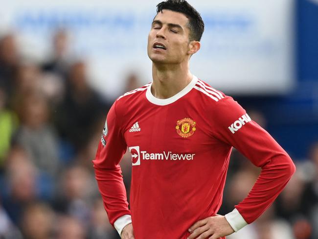 Manchester United's Portuguese striker Cristiano Ronaldo reacts during the English Premier League football match between Brighton and Hove Albion and Manchester United at the American Express Community Stadium in Brighton, southern England on May 7, 2022. (Photo by Glyn KIRK / AFP) / RESTRICTED TO EDITORIAL USE. No use with unauthorized audio, video, data, fixture lists, club/league logos or 'live' services. Online in-match use limited to 120 images. An additional 40 images may be used in extra time. No video emulation. Social media in-match use limited to 120 images. An additional 40 images may be used in extra time. No use in betting publications, games or single club/league/player publications. /