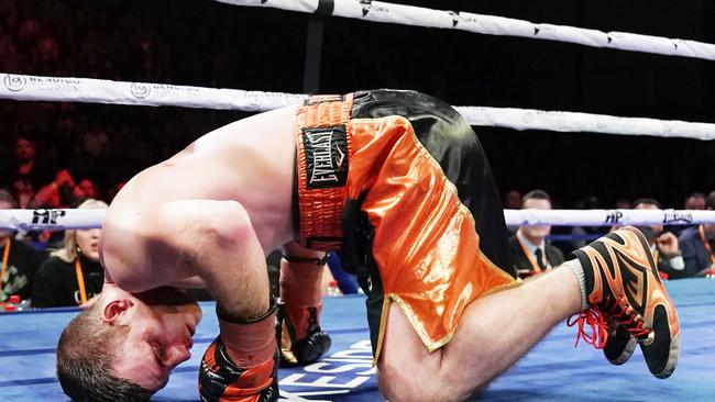 Down and almost out. Jeff Horn hits the deck against Michael Zerafa before climbing to his feet and copping more punishment against Michael Zerafa.Picture: Michael Dodge/AAP