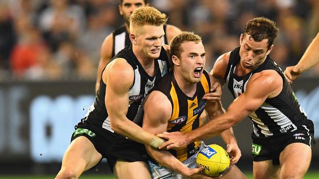 Pie Adam Treloar had words with Tom Mitchell at one stage during Saturday night’s clash. Picture: Getty Images