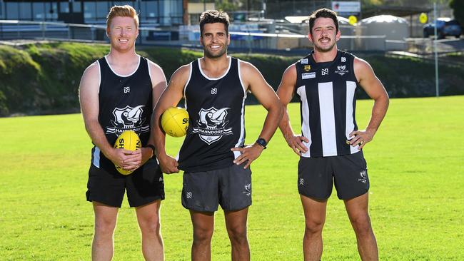 Former Adelaide AFL and Woodville-West Torrens SANFL player Jared Petrenko (C) back with his ex-Crows teammates Kyle Cheney (L) and Matthew Jaensch (R) at the Hahndorf Football Club. Picture Mark Brake