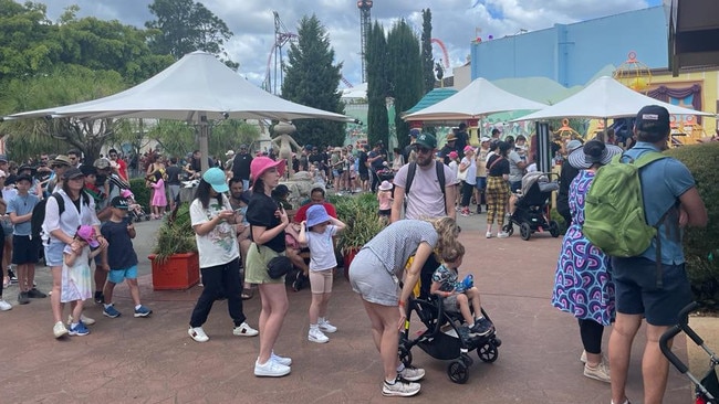 Crowds wait in long lines for rides at Movie World on the Gold Coast.