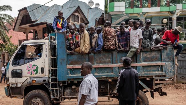 Civilians allegedly joining the M23 ride a truck as they arrive to an enrolment of civilians, police officers, and former members of the Armed Forces of the Democratic Republic of Congo last month. Picture: Luis Tato/AFP