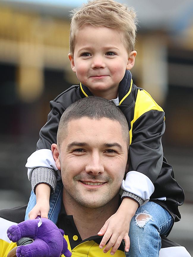 Richmond footballer Shaun Grigg and his son Sonny, 3. Picture: Alex Coppel