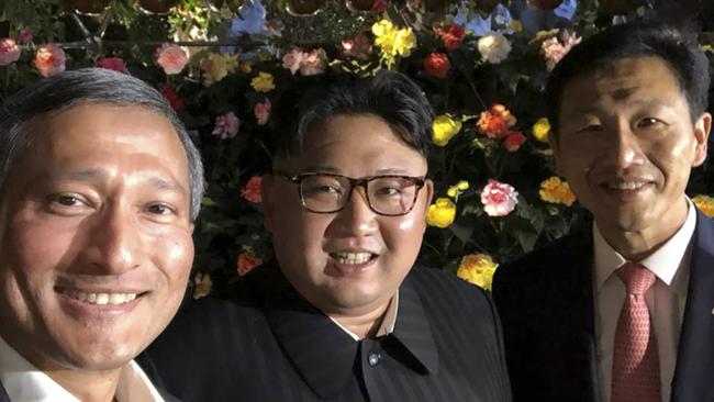 Singapore Foreign Minister Vivian Balakrishnan (L)  takes a selfie with Kim Jong-un. Picture: AFP.