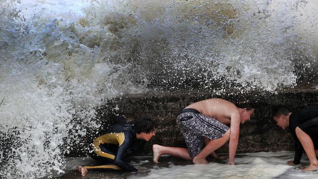 Big waves break over Snapper Rocks on the Gold Coast. Picture: NIGEL HALLETT