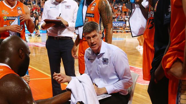 Taipans head coach Mike Kelly talks to his players during a time out in the National Basketball League (NBL) match between the Cairns Taipans and the Adelaide 36ers, held at the Cairns Convention Centre. PICTURE: BRENDAN RADKE.