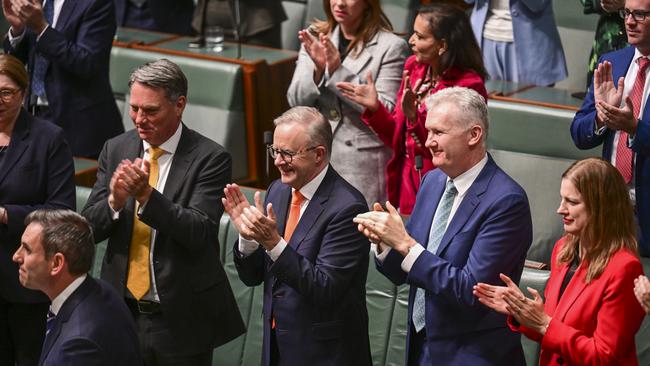 Deputy PM Richard Marles, Prime Minister Anthony Albanese and Leader of the House Tony Burke congratulate Treasurer Jim Chalmers after he handed down the 2023 Budget in the House of Representatives at Parliament House.