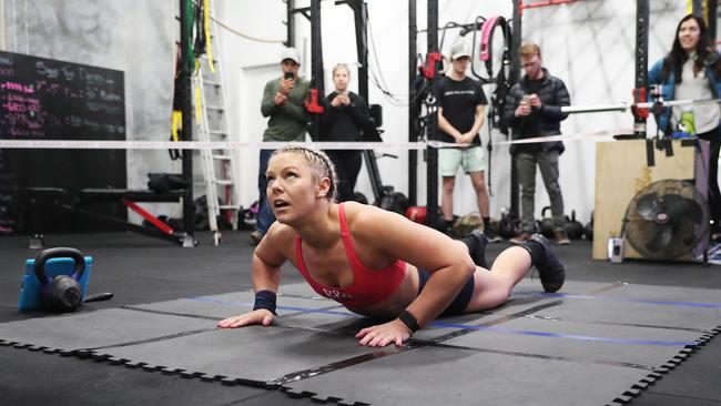 Burpees see a person lie prone, using their arms to push up then jumping into the air before landing in a squat.