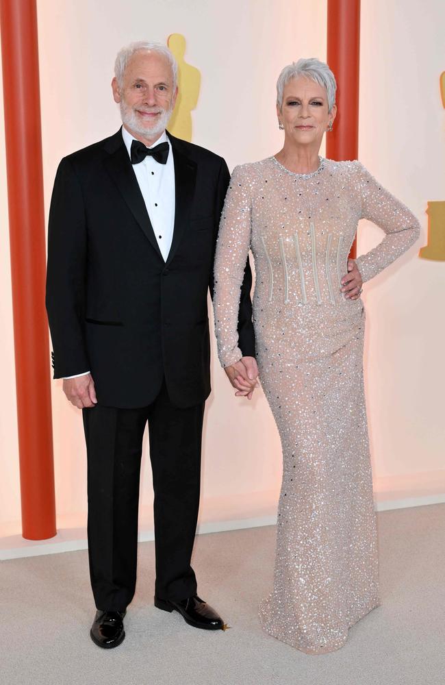 Oscar nominee Jamie Lee Curtis wears sequinned Dolce Gabbana as she arrives with her husband Christopher Guest. Picture: AFP