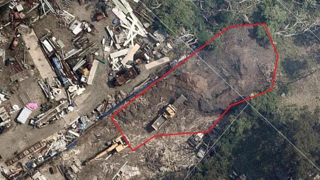 Aerial view of the massive pile of mulch in Mt Ku-ring-gai surrounded by crown bushland adjacent to Berrowra Valley National Park. Picture: NSW EPA