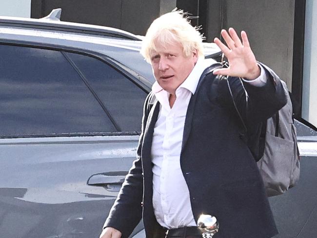 Former British Prime Minister Boris Johnson walks, at Gatwick Airport, near London, Britain October 22, 2022. REUTERS/Henry Nicholls